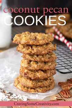 a stack of coconut pecan cookies sitting on top of a table next to a glass of milk