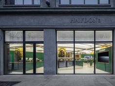 the front entrance to a store with glass doors and windows that say, haydon