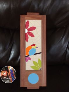 a wooden frame with an image of a bird on it