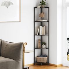 a living room filled with furniture and a book shelf next to a window on the wall