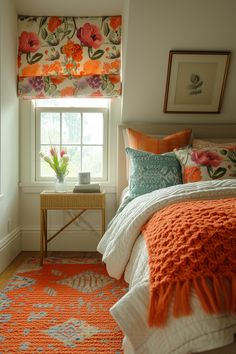 a bedroom with an orange and white bedding, floral patterned window valance, and colorful pillows