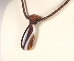 Minimalist Kumihimo Necklace With Coffee Agate Pendant And Brown Necklace With Sliding Knot For Gift, Brown Necklace With Natural Variations For Gifts, Earthy Brown Jewelry With Sliding Knot, Gift Macrame Necklaces With Round Beads, Brown Macrame Necklace For Festival, Unique Macrame Pendant Necklace, Gift Amulet Style Macrame Necklace, Unique Brown Macrame Necklace, Kumihimo Necklace