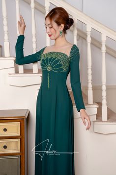 This floor length dress features a beautiful moss green fabric color, adorned with intricate beaded patterns. Its elegant design exudes sophistication and style, making it the perfect choice for any formal occasion. Elevate your wardrobe with this timeless piece. Green Embellished Dress With Fitted Bodice, Elegant Floor-length Green Gown, Fitted Dark Green Evening Dress For Banquet, Festive Green Evening Dress For Banquet, Green Fitted Bodice Maxi Evening Dress, Green Fitted Bodice Maxi Length Evening Dress, Green Floor-length Evening Dress With Fitted Bodice, Green Embellished Long Sleeve Evening Dress, Green Festive Evening Dress