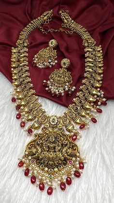 Matte Nakshi Goddess lakshmi Long Haar Necklace in Antique Finish with Red Beads and Pearls. Traditional Matte Necklace. Pair it up Silk saree or lehenga Necklace Length : 24 Inches; comes with adjustable back chain. Earring Length : 2.25 Inches Approx. Push Back  Ready to ship from Boston, Massachusetts. If you have any questions let me know. Thank you!! Gold Kundan Necklace With Meenakari In Traditional Drape, Bollywood Style Temple Necklace With Latkans For Diwali, Bollywood Temple Necklace With Latkans For Diwali, Heavy Traditional Saree For Festivals, Peacock Design Necklaces For Puja And Diwali, Gold Jewelry Sets With Peacock Design For Festivals, Heavy Gold Traditional Wear For Navratri, Gold Kundan Necklace In Traditional Drape, Gold Kundan Necklace With Zari Work