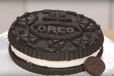 an oreo cookie cake on a white plate