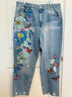 Size:  17, waist 35/36 In seam:  27" This is a beautiful shade of blue denim floral jeans that will look great with anything.  Wear it with a plain white T-shirt with a light denim jacket or with a colorful girly top.  It's a wearable art/statement piece.  It's perfect for all year around.  It's sweet and girly.  It's vintage/retro style. Spring High Waist Bohemian Jeans, Bohemian High Waist Jeans For Spring, Spring Bohemian High Waist Jeans, Embroidered Denim Flare Jeans For Fall, Spring Embroidered Denim Blue Pants, Fall Embroidered Denim Flare Jeans, Bohemian Denim Blue Jeans For Spring, Bohemian High-rise Bottoms For Spring, Bohemian High Rise Bottoms For Spring