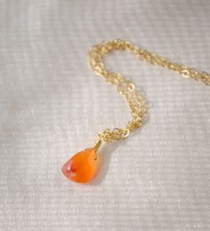 "* Genuine Carnelian Pendant in Sterling Silver or 14k Gold Filled * Harness the potent energy of Carnelian! Carnelian is the orange variety of Quartz that's known for its ability to stoke creativity, foster positivity, and stimulate passion. This isn't just a necklace - it's a tool for transformation.  We hand select each triangular-shaped gem when crafting your one-of-a-kind necklace. Carnelian naturally ranges in color from orange to red and can be either solid in color, or with colorful band Orange Gemstone Drop Jewelry, Orange Drop Gemstone Jewelry, Orange Teardrop Citrine Jewelry, Carnelian Gemstone Drop Jewelry, Gold Carnelian Teardrop Jewelry, Gold Carnelian Jewelry With Birthstone, Gold Carnelian Birthstone Jewelry, Orange Carnelian, Carnelian Necklace