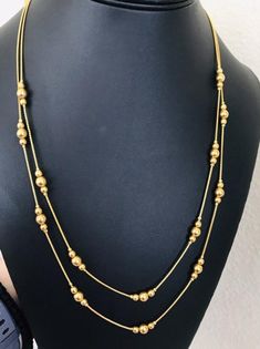 This Avon elegant two layered gold bead and chain swag necklace is 23 inches long on the inner layer. It is a pretty necklace and is marked Avon on the clasp. I specialize in finding fun wearable jewelry. Please browse my shop for more options. I box jewelry sales ready for gift giving. I Box, Wearable Jewelry, 80s Theme Party, Wire Cuff, Pretty Necklace, Pretty Necklaces, Box Jewelry, Copper Bracelet, Bright Gold