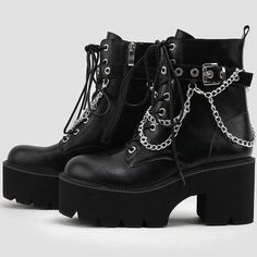 Description:Step into a rock-punk style and comfort this season with the exaggerated platform booties. Made of PU leather and thermoplastic rubber, embellished with metallic detailing embodied with an adjustable buckle closure and layered chains, featuring a round closed toe framed by a faux leather upper, a lightly cushioned footbed anchored by a shock-absorbing ridged outsole, an ankle-length shaft dotted with a lace-up fastening and silver-tone eyestays, a chic platform structured with a rubber block heel. Find more trendy women's platform boots and unique shoes in our boutique, and pair the lace-up boots well with a slashed mini dress and a cropped cardigan for a stylish street look - Heel height: 8cm. Size Length(in) Length(cm) 35 8.86 22.5 36 9.06 23 37 9.25 23.5 38 9.45 24 39 9.65 2 Punk Martin Boots With Chunky Platform And High Heel, Punk Style Martin Boots With Platform High Heel, Edgy Martin Boots With Chunky Platform And High Heel, High Heel Chunky Platform Martin Boots For Streetwear, Chunky Platform High Heel Martin Boots For Streetwear, High Heel Martin Boots With Chunky Platform For Streetwear, Grunge High Heel Moto Boots For Fall, Fall Grunge High Heel Moto Boots, Punk Style Martin Boots With Platform