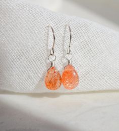 "Sunstone is thought to carry the invigorating energy of the sun, making it ideal for anyone feeling stuck or in need of a nudge to embrace life and have some fun. It's a powerful gemstone that boosts self-confidence and encourages happiness, love, and good luck. These earrings are meticulously crafted with real, smooth polished Sunstone teardrops that shimmer! Choose between sterling silver or 14k gold filled earring hooks. Stone Size: average 9 to 10mm (.3\") Metal: 14k Gold Filled or Sterling Sunstone Earrings, Healing Crystal Jewelry, Embrace Life, Gemstone Jewelry Handmade, Gold Filled Earrings, Feeling Stuck, Earring Hooks, Matching Necklaces, Gemstone Healing