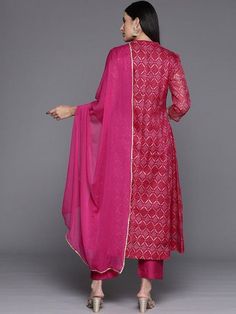 Grab this beautiful 3-piece set. The set comes with bandhani print & zari embroidery anarkali kurta has mandarin collar, 3/4th sleeves & calf length teamed with solid trouser pant with elasticated waistband & slip-on closure and a silk chiffon dupatta with lace detailing. Color - Pink Kurta Fabric-Cotton Blend Bottom Fabric-Silk Blend Dupatta Fabric - Silk Chiffon Neck-Mandarin Colar Sleeves-3/4th Sleeves Work - Bandhani Print & Zari Embroidery Washing Instructions-Hand Wash DISCLAIMER - The col Designer Georgette Palazzo Set With Bandhani Print, Semi-stitched Bandhani Print Salwar Kameez, Designer Bandhani Print Palazzo Set For Navratri, Semi-stitched Palazzo Set With Dupatta For Navratri, Eid Designer Palazzo Set With Bandhani Print, Eid Bandhani Print Palazzo Set For Designer Wear, Navratri Wedding Palazzo Set With Bandhani Print, Wedding Palazzo Set With Bandhani Print For Navratri, Designer Pink Palazzo Set With Bandhani Print