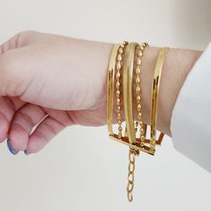 This five strands bracelet is perfect for those that loves minimalist pieces but wanted to create a classy stack that goes with any look. The detail of the different strands gives an unique touch and is the best of the two words: Minimalist but also elegant bold. Can be worn alone or with other bracelets. Bracelet Details: Material: 18K Gold Plated & Stainless Steel Length: 7' Inch Thickness: 8mm Quantity: 1 Color: Gold Does not tarnish/change color overtime Water Resistant Check Our Jewelry Car Bracelet Paper, Girl Boss Gift, Cuban Bracelet, Jewelry Girl, Chunky Bracelet, Bracelet Minimalist, Boss Gift, Jewelry Minimalist, Chunky Bracelets