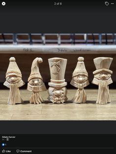 a group of wooden figurines sitting on top of a table