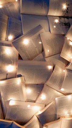 many open books with lights on them