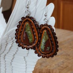 Hand picked unique cut gemstones pieces to make these standout one of a kind leather earrings.  -Your choice of Bloodstone and different variations of Turquoise  -Surgical Steel hooks -Stainless steel bails -Doubled leather -Briar brown finished  Find more of my rustic my hand made designs ## https://www.etsy.com/shop/KCsDesignsShop $ this site has coupon codes -message for any questions you may have Buffalo Nickel, Western Leather, Oyster Shell, Leather Cuffs, Ear Wire, Make Design, Turquoise Gemstone, Leather Earrings, Leather Tooling