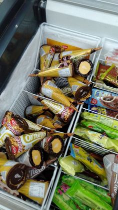 an open refrigerator filled with assorted snacks