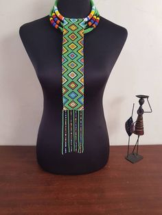 This set is perfect for weddings, traditional events , African themed events etc. *This set makes a perfect gift. In this listing, you will get both necklaces like shown above. *Long pendant necklace. *2 in 1 necklace. Custom orders are welcome. More neckleces here; https://www.etsy.com/shop/TribalTess?ref=seller-platform-mcnav&section_id=21306083 Back to my shop; https://www.etsy.com/shop/TribalTess?ref=seller-platform-mcnav Traditional Handmade Beaded Necklaces With Round Beads, Traditional Handmade Beaded Necklace With Round Beads, Bohemian Handmade Beaded Necklaces For Traditional Ceremonies, Traditional Handmade Beaded Necklace, Traditional Handmade Beaded Necklaces For Ceremonies, Traditional Adjustable Necklaces With Colorful Beads, Traditional Adjustable Necklace With Colorful Beads, Traditional Necklaces With Colorful Beads And Adjustable Fit, Handmade Multicolor Jewelry For Traditional Ceremonies