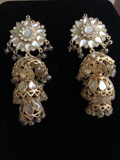 Elegant Kundan Jhumkas With Gota Work, Elegant Chandbali Jhumkas With Gota Work, Elegant Festive Jhumkas With Gota Work, Elegant Jhumkas With Gota Work For Diwali, Elegant Chandelier Earrings With Gota Work For Wedding, Elegant Bridal Earrings With Gota Work For Festive Occasion, Elegant Chandbalis With Gota Work For Celebrations, Elegant Jhumkas With Gota Work For Parties, Elegant Chandbalis With Gota Work For Festive Occasions