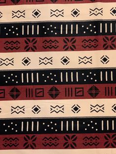 a red, black and white pattern on fabric