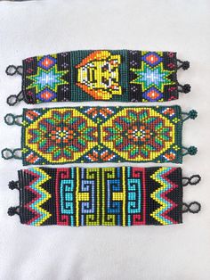 Wide ceremonial bracelets made of beads. Choose the Cactus or Lion design. Artisan Beaded Bracelets With Large Beads For Festivals, Spiritual Handmade Wristband For Festivals, Bohemian Festival Bracelets With Rectangular Shape, Handmade Cuff Bracelet With Round Beads For Festivals, Handmade Round Beads Cuff Bracelet For Festival, Handmade Green Bracelets For Festivals, Festival Black Bracelets With Large Beads, Traditional Handmade Green Beaded Bracelets, Artisan Beaded Bracelets With Colorful Beads For Festivals