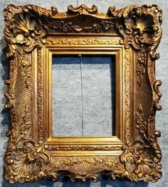 an ornate gold frame hanging on the wall