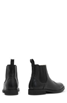 Elevate your closet staples with this sleek leather Chelsea boot featuring Western-inspired paneling at the heel and a rugged rubber sole. 5 1/2" shaft Lace-up style Leather and textile upper and lining/rubber sole Made in Portugal Leather High Ankle Boots With Reinforced Toe, Fitted High Ankle Boots With Lug Sole, Fitted Black Boots With Vibram Sole, Classic Chelsea Boots With Rubber Heel Cap, Leather Chelsea Boots With Reinforced Toe, Classic Combat Boots With Vibram Sole For Winter, Leather High-top Chelsea Boots For Work, Classic High Ankle Combat Boots With Leather Sole, Fall Chelsea Boots With Moc Toe And Reinforced Toe