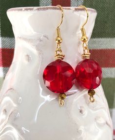 Red earrings are a square glass bead earring. These red drop earrings are festive and fun for holiday get togethers and gatherings!  Can even be worn to match red bridesmaid attire.  Simple Dangle Earrings * Just the right size for women * Dark red glass beads * Gold played fish hook ear wires * Rubber back stoppers Earrings are READY TO SHIP!!  Ship time is 3-5 business days. Free tracking.  MORE RED https://www.etsy.com/shop/MiksJewelryShop?search_query=red MORE DANGLE EARRINGS https://www.ets Holiday Red Beaded Earrings With Ear Wire, Red Beaded Earrings For Holiday, Red Beaded Earrings For Holiday With Round Beads, Red Crystal Drop Earrings For Gifts, Nickel Free Red Crystal Earrings For Parties, Holiday Jewelry With Matching Drop Earrings, Gold Beaded Earrings With Faceted Beads For Gifts, Red Jewelry For Holiday Jewelry Making, Gold Holiday Drop Earrings