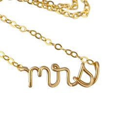 "Mrs lowercase classy script necklace. Made from 14k gold filled wire and chain. The model wears a 16\" necklace. What is 14k gold filled? It is 14k solid gold heat bonded to brass. The coating of gold is 1000x thicker than gold plated. It can last a lifetime if cared for properly. Care instructions will be included. Have questions? Concerns? I'd love to chat with you! ◊◊ Message me on Etsy convo here: https://www.etsy.com/conversations/new?with_id=7293349 OR email me at: aziza [!at] azizajewelry.com ◊◊ Stay a while, keep shopping: http://www.etsy.com/shop/AzizaJewelry ◊◊ Shipping:  Standard Shipping within the US is via USPS First Class Mail, ships within 3-5 days and can take 7-10 business days to arrive  ◊◊ RUSH Priority Mail ships within 1-2 business days and takes 3-5 days to arrive ◊ 14k Gold Charm Necklaces For Wedding And Mother's Day, Gold Custom Name Charm Necklace For Wedding, Gold Charm Necklace With Custom Name For Wedding, Custom Name Gold Necklaces For Wedding, Dainty Custom Name Necklaces For Wedding, Gold Name Necklace For Wedding, Custom Name Gold Necklace For Wedding, Elegant Gold Name Necklace For Bridesmaid, Elegant Adjustable Wedding Name Necklace