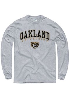 Show off your team pride in this Oakland University Golden Grizzlies Grey Arch Mascot Long Sleeve T Shirt! This Griz Long Sleeve Tee features a screen printed Oakland wordmark and logo. Make sure everyone knows you root for the Golden Grizzlies with this Grey Griz T Shirt. Go Golden Grizzlies! Classic fit, Seamless double needle 7/8" collar, Taped neck & shoulders, Ribbed cuffs, Unisex, Fit: True to Size, 100% Cotton Collegiate Long Sleeve T-shirt With Screen Print, Athletic Heather Long Sleeve T-shirt With Letter Print, Collegiate Long Sleeve T-shirt For College, Long Sleeve T-shirt With Team Logo For Streetwear, Long Sleeve T-shirt With Team Name For Fans, Long Sleeve Cotton T-shirt With Team Spirit, Long Sleeve Graphic Print T-shirt For Sports Fans, Long Sleeve Cotton T-shirt With Team Name, Long Sleeve Cotton T-shirt For Fans