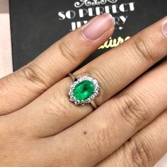 "ENJOY OUR WORRY-FREE SERVICE AND THE DAZZLING, GENUINE JEWELRY WE DESIGN AND HANDCRAFT WITH LOVE❤️ ABOUT THE ITEM: This ring is the perfect combination of elegance, simplicity, and INVESTMENT VALUE! With a CLEAN 1.18 carats, VIVID COLOMBIAN GREEN emerald, and 14 extremely sparkling diamonds. The ring was deliberately designed and handcrafted by our boutique's in-house goldsmiths. You will love this gorgeous piece as much we do. And people will absolute adore it once they see the sparkle and the Classic White Gold Emerald Ring For Proposal, White Gold Brilliant Cut Emerald Ring For Proposal, Gia Certified Oval Diamond Ring For Gift, Classic Platinum Emerald Ring With Halo Design, Gia Certified Diamond Halo Ring Gift, Wedding Emerald Ring Brilliant Cut In 14k White Gold, Gia Certified Round Cut Emerald Ring For Proposal, Classic White Gold Emerald Ring With Halo Design, Gia Certified Emerald Wedding Ring Round Cut