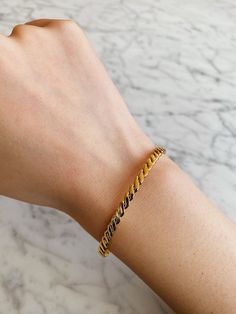 Minimal gold bangle bracelet. Simple and chic style, your go to every-day jewelry. You can wear it alone or layer it with other gold bracelets. A perfect addition to your jewelry collection!………………………………….D E T A I L S• Materials: Stainless steel, 18k gold plating.• Diameter: 2.3 inches (6 cm) • Width: 3 mm• This product is hypoallergenic, water and tarnish resistant Trendy Gold Cuff Bracelet With Jubilee Style, Trendy Gold-plated Tarnish-resistant Bangle, Trendy Yellow Gold Bangle For Formal Occasions, Gold Stackable Cuff Bracelet For Everyday, Trendy Yellow Gold Bangle Bracelet, Trendy Stackable Gold Bangle Bracelet, Trendy Stackable Yellow Gold Bracelet, Gold-plated Gold Bangle For Everyday, Dainty Stackable Gold Cuff Bracelet