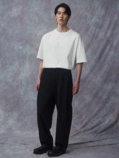 It is a tapered fit pant that has relaxed fit on the thigh and gets narrow to the hem. The pant is made of classic Oxford textile using aero cooling yarn by ‘Takisada Nagoya’. The elastic band waist is adjustable using drawstring. The pant is matched with Minimal Work Zip Up Jacket as a set.- Basic pant- Relaxed tapered fit- Elastic band waist- Side pockets- Back pockets Tapered Pants Outfit Men, Modern Pants With Relaxed Fit And Straight Hem, Black Minimal Stretch Elastane Pants, Black Tapered Leg Daywear Pants, Black Relaxed Fit Tapered Leg Pants, Men’s Tapered Pants, Tapered Pants Outfit, Black Pants Outfit Men, Black Pants With Relaxed Fit And 5-inch Inseam