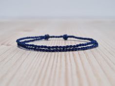 Simple dark blue string bracelet, made from a nylon cord.  The bracelet has an adjustable size thanks to the sliding knot. This a simple fabric jewelry that can be worn alone or stacked with other bracelets. Suitable for both men and women. The bracelet is fully water-resistant, so you can swim and shower with it. - - - - - - - - - - Materials: Nylon cord - Color: Dark Blue - - - - - - - - - Adjustable size - Open from 15cm (5.9") to 25cm (9.8"). - - - - - - - - - - More slip knot bracelets colo Slip Knot Bracelets, Sliding Knot Bracelet, Knot Bracelets, Simple Fabric, Slip Knot, Surfer Bracelets, Bracelet Knots, Knot Bracelet, Sliding Knot