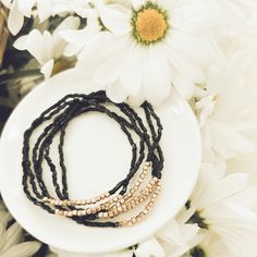 Elevate your style with our Black Stacking Bracelets. These beautiful pieces bring a touch of nature's beauty to your wrist. Mix and match for a stunning, boho-chic look. Bohemian Wrap Bracelet With Adjustable Length As Gift, Adjustable Bohemian Wrap Bracelet As Gift, Elegant Adjustable Wrap Bracelet For Festival, Elegant Adjustable Stretch Bracelet For Beach, Black Bohemian Stretch Bracelet Stackable, Hand Wrapped Black Beaded Bracelets For Beach, Black Bohemian Stackable Stretch Bracelet, Bohemian Black Stackable Stretch Bracelet, Elegant Stackable Beaded Bracelets For Beach