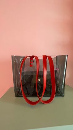 "City style, office bag, practical everyday tote, vinyl purse, shoulder handbag, oversize stylle, transparent tote, easy wipe, gift for nurse Dimensions: 12,5 inches  wide  10 inches height and 5 1/2 depth / 32 cm wide 25 cm height and 14 cm depth Made of thick, crystalline, flexible PVC. One side black and ane transparent clear. Leather straps colour  to choose ( in the picture caramel) A large handbag city, type of shopper .  The modern concept of boho style , oversize .  Large transparent  BA Everyday Use Satchel Shoulder Bag With Clear Strap, Everyday Shoulder Bag With Clear Strap, Rectangular Clear Shoulder Bag For Shopping, Modern Clear Rectangular Shoulder Bag, Rectangular Bags With Clear Strap For On-the-go, Clear Shoulder Bag With Removable Pouch For Everyday, Everyday Clear Satchel With Removable Pouch, Everyday Clear Shoulder Bag With Removable Pouch, Modern Clear Rectangular Bag