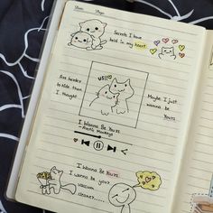 an open notebook with doodles on it and pictures of animals in the pages,