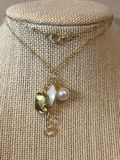 "From my Crown&Clover collection! Gold Vermeil Charms of pearls, etched North Star, and a 10x13 mm white agate oval gem all play nicely on a paperclip 18\" necklace. There is a tiny, faceted rock crystal charm at the bottom of the necklace.  Simple spring ring closure. Such a perfect layering piece.  I love the look of the lightweight, gold charms mixing with a heavier chain or colorful beads for a Fall look. My Crown & Clover pieces are brand-new, never worn. Please check out my other site! The White Oval Link Necklace For Anniversary, Elegant White Charm Necklace With Paperclip Chain, White Pearl Charm Jewelry, Classic White Oval Link Jewelry, White Oval Jewelry With Pearl Charm, White Pearl Charm Necklace In Gold Plated, Yellow Gold Pearl Charm Necklace, Gold-tone Chain Necklace With Pearl Charm, White Pearl Charm Necklace, Gold Plated