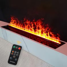 a remote control sitting in front of a fire