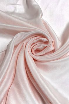 Mostly recognized for its crinkled texture with a granular surface, this beautiful Light Pink Light Silk Crepe CRP-004 Fabric is 100% silk fabric, and it is perfect for all kinds of garments. Fashion designers choose it for designing bridal gowns, evening wear, dresses, skirts, shirts, pants, jackets, sportscoats and blazers. Our Light Silk Crepe fabric is available in a wide range of colors. Purchase fabric by the Yard at NY Designer Fabrics. The fabric measures 44 inches in width. Silk Crepe Fabric, Evening Wear Dresses, Light Silk, Light Pink Dress, Dupioni Silk, Sweet 16 Parties, Silk Wool, Pink Light, Crepe Fabric