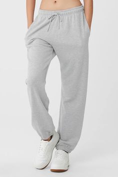 Chill Sweatpant - Athletic Heather Grey | Alo Yoga Comfortable Full-length Bottoms, Alo Yoga Solid Color Pants With Pockets, Alo Yoga Solid Pants With Pockets, Gray Full-length Jogging Pants, Sporty Bottoms With Side Pockets For Lounging, Loosely Fitted Solid Sweatpants For Sports, Comfortable Solid Color Lounge Pants, Solid Relaxed Fit Sportswear Bottoms, Sporty Sweatpants With Elastic Waistband For Lounging