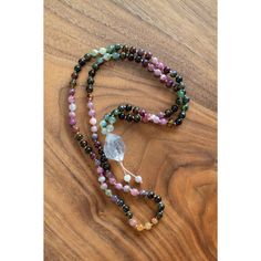 "Daring to set boundaries is about having the courage to love ourselves, even when we risk disappointing others." -Brene BrownTourmaline is a shamanic stone, providing protection during ritual work... or life in general. Multicolored Tourmaline brings the body, mind, and spirit into wholeness. This 108 bead gemstone mala can be used traditionally to give one direction. Each bead is meticulously placed for the most lovely effect. You can order this mala with or without a tassel and adjustable. The adjustable one can be worn as a necklace or as a bracelet (see photos)Stones in this mala:*6mm Tourmaline is the stone of protection and guidance.*Tibetan Quartz Crystal is the ultimate healing crystal.-Ethically sourced high-end stones, cut and polished in small, family-owned factories paying liv Mala Necklace Design, Handmade Spiritual Crystals For Meditation, Handmade Spiritual Healing Crystals, Handmade Spiritual Crystals For Healing, Multicolor Spiritual Healing Crystals, Multicolor Healing Crystals, Holistic Natural Stones Crystals For Meditation, Holistic Healing Crystals With Natural Stones, Multicolor Spiritual Gemstone Beads Crystals