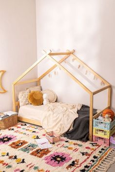 a bedroom with a bed, rugs and other items on the floor in front of it