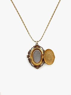 Indulge in timeless elegance with this rare antique cameo locket. Crafted in 12k gold-fill, this exquisite piece exudes charm and nostalgia. The oval shape, measuring 1.5 cm in width and 2 cm in length, showcases meticulous craftsmanship, featuring a detailed carved cameo and etched floral back. Stamped Van Dell, indicating the piece is from the 1940s, and made in Rhode Island. This vintage gem is not just a locket; it's a piece of art that transcends eras. The secure click-shut mechanism ensure Gold Brass Locket Necklace For Formal Occasions, Gold Brass Locket Necklace For Formal Events, Vintage 14k Gold Necklace With Intricate Design, Gold Medallion Locket Necklace With Filigree, Heirloom Locket Pendant Necklace, Vintage 14k Gold Necklace In Antique Gold, Formal Gold Brass Locket Necklace, Antique 14k Gold Locket Jewelry, Victorian Yellow Gold Locket Necklace For Formal Occasions