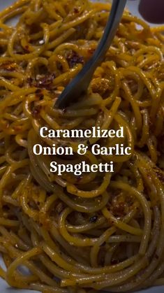 caramelized onion and garlic spaghetti on a white plate