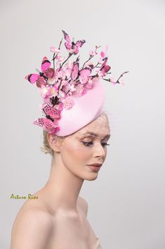 Cherry blossom fascinator made on a Pink pillbox base adorned with vintage silk cherry blossom branches in two shades of pink with 6 assorted pink canvas butterflies and pink netting. An elastic string is attached to the pillbox, pretty light and easy to wear. All my hats are hand made to order, please allow 1-2 weeks, if this is a rush order please contact me. Hat box included for domestic orders only. International orders, headpiece will be nicely packed to protect it during the trip. Thank you Pink Feminine Fascinator For Wedding, Pink Headpieces For Royal Ascot Event, Pink Fascinator For Royal Ascot, Flower-shaped Mini Hats For Spring Evenings, Pink Fascinator For Royal Ascot Races, Whimsical Pink Headpieces For Gifts, Pink Handmade Flower Headpieces For Royal Ascot, Whimsical Pink Headpieces As Gift, Pink Feminine Fascinator For Evening