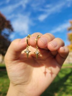 Materials:  Hoop- stainless steel (in gold color) Charm- 18k gold plated CZ star drop Item Details: The earrings are for 1 PAIR and only come in the CLIP ON version for NON PIERCED ears. These stainless steel clip on hoop earrings use a spring closure and look very realistic (like pierced earrings).  US customers: Receive FREE US shipping by making an order of $35 or above from my shop. Non-US customers: If you order multiple items from my shop at once, the shipping cost will be for one piece. I Clip On Earrings Dangle, Dangly Clip On Earrings, Clip On Dangle Earrings, Aesthetic Clip On Earrings, Gold Stainless Steel Jewelry With Star Charm, Gold Plated Star Hoop Earrings Tarnish Resistant, Gold Plated Star Hoop Earrings, Gold Plated Star Shaped Hoop Earrings, Gold Plated Star-shaped Hoop Earrings