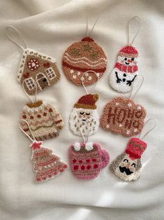 knitted ornaments are arranged on a white sheet