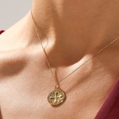 Embrace the spirit of luck with our Shamrock Coin Necklace. The pendant, featuring a delicately designed shamrock, is suspended from a radiant gold chain, creating a timeless accessory with a touch of Irish flair. This necklace adds a charming and whimsical element to any outfit. The Shamrock Coin Necklace is a beautiful embodiment of luck and style, making it a must-have addition to your jewelry collection. - Made in 14k solid gold - Pendant: 19.50x17.00 mm / 0.77x0.67 inches - Pendant Thicknes Yellow Gold Pendant Charm Necklace With Flower, Yellow Gold Flower Charm Pendant Necklace, Dainty Round Pendant Charm Necklace For Good Luck, Gold Plated Flower Charm Pendant Necklace, Good Luck Medallion Necklace With Charms, Dainty Flower Pendant Charm Necklace For Good Luck, Gold Plated Round Necklace For Good Luck, Dainty Good Luck Flower Pendant Charm Necklace, Good Luck Charm Necklace With Delicate Chain