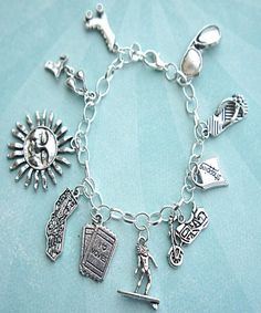 this charm bracelet features california inspired Tibetan silver charms(nickel free).the charms are attached to a silver tone 7.5 inches chain bracelet Themed Silver Jewelry With Charms, Silver Sterling Charm Bracelet With Dangling Charms, Silver Symbolic Bracelets With Dangling Charms, Symbolic Charm Bracelet With Dangling Charms, Symbolic Silver Bracelets With Dangling Charms, Symbolic Silver Bracelet With Dangling Charms, Silver Metal Chain Bracelet With Dangling Charms, Symbolic Dangle Charm Bracelet, Themed Silver Metal Charms