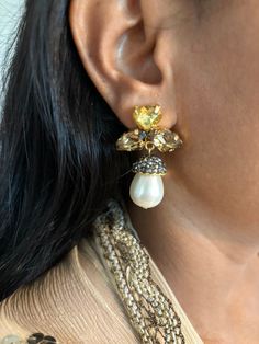 Prepare yourself for the festive season ♥️ Stylish Pearl and Crystal Earrings. The material is brass with gold plating and stones  Weight: 18 grams a pair Length: 4.5 cm Width: 2.5 cm Prong Setting Push Back Closure  Can go well with both Indian and Western wear. Yellow Gold Plated Earrings For Festive Occasion, Yellow Gold-plated Earrings For Festive Occasion, Jeweled Drop Danglers For Gift, Elegant Jeweled Crystal Earrings For Festive Occasions, Festive Single Dangle Pearl Earring, Festive Gold Single Earring, Festive Single Gold Earring, Festive Gold Plated Pearl Earrings For Pierced Ears, Festive Gold Jeweled Chandelier Earrings